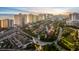 An aerial view of a beautiful community of townhomes with a golf course, beach, and high rise condos at 2934 Oceans Trce, Daytona Beach Shores, FL 32118