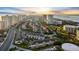 An aerial view of a beautiful community of townhomes with a golf course and waterway nearby at 2934 Oceans Trce, Daytona Beach Shores, FL 32118