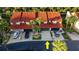 Aerial view of townhomes with red tile roofs, garages, driveways, and manicured landscaping at 2934 Oceans Trce, Daytona Beach Shores, FL 32118