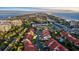 An aerial view of beautiful community of townhomes near the beach with a pool and waterway nearby at 2934 Oceans Trce, Daytona Beach Shores, FL 32118