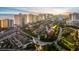 An aerial view of a beautiful community of townhomes with a golf course, beach, and high rise condos at 2934 Oceans Trce, Daytona Beach Shores, FL 32118