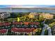 An aerial view of a beautiful community of townhomes with a golf course and waterway nearby at 2934 Oceans Trce, Daytona Beach Shores, FL 32118