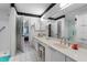 Bathroom featuring double sinks, large mirror and vanity with white cabinets at 2934 Oceans Trce, Daytona Beach Shores, FL 32118