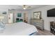 Inviting bedroom with neutral colors, hardwood flooring, and natural lighting at 2934 Oceans Trce, Daytona Beach Shores, FL 32118