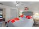 Comfortable bedroom with ceiling fan, hardwood floors, and ensuite bathroom at 2934 Oceans Trce, Daytona Beach Shores, FL 32118