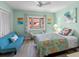 Bedroom featuring plenty of sunlight from large window, hardwood floors, and blue walls at 2934 Oceans Trce, Daytona Beach Shores, FL 32118