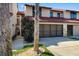 Townhome exterior with a two-car garage and small, landscaped front yard at 2934 Oceans Trce, Daytona Beach Shores, FL 32118