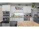 Well-equipped kitchen boasting updated appliances, elegant cabinetry, and abundant counter space at 2934 Oceans Trce, Daytona Beach Shores, FL 32118