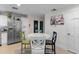 Charming kitchen area with a white round table and stainless steel refrigerator at 2934 Oceans Trce, Daytona Beach Shores, FL 32118