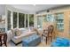 Relaxing living room with large bay window, display cabinets and tile flooring at 2934 Oceans Trce, Daytona Beach Shores, FL 32118