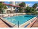 Gorgeous community pool with ample lounge seating and lush landscaping for a tranquil experience at 2934 Oceans Trce, Daytona Beach Shores, FL 32118