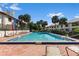 Beautiful community pool offering a refreshing escape, surrounded by lounge chairs and tropical landscaping at 2934 Oceans Trce, Daytona Beach Shores, FL 32118