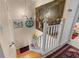 Well lit staircase with eye catching painting and unique decor at 2934 Oceans Trce, Daytona Beach Shores, FL 32118