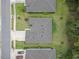 Aerial view of a home with a well-maintained roof, surrounded by lush landscaping and neighboring houses at 3029 Adrian Dr, Ormond Beach, FL 32174