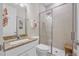 Modern bathroom featuring a tiled shower and granite countertop vanity at 3029 Adrian Dr, Ormond Beach, FL 32174