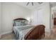 A bedroom is decorated with a wooden bedframe and matching dresser at 3029 Adrian Dr, Ormond Beach, FL 32174