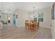 Dining room with wood table and chairs set, ample natural light, and sliding glass doors at 3029 Adrian Dr, Ormond Beach, FL 32174