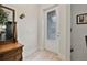 Bright entryway featuring wood-look tile floors, and a door with decorative glass at 3029 Adrian Dr, Ormond Beach, FL 32174