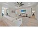 Inviting living room with a white sectional, beach artwork, and hardwood floors at 3029 Adrian Dr, Ormond Beach, FL 32174