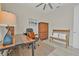 Office space with dark wood desk, executive chair, and a wooden bench at 3029 Adrian Dr, Ormond Beach, FL 32174