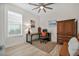 Office space featuring a dark wood desk, executive chair, and rustic wooden cabinet at 3029 Adrian Dr, Ormond Beach, FL 32174