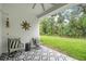 Inviting outdoor patio with stylish seating and a lush garden view at 3029 Adrian Dr, Ormond Beach, FL 32174