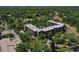 Gorgeous aerial showcases the condo surrounded by lush greenery and landscaping at 640 N Nova Rd # 117, Ormond Beach, FL 32174