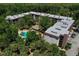 Aerial shot of the condo highlighting the pool area and well-maintained landscaping at 640 N Nova Rd # 117, Ormond Beach, FL 32174