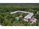 Scenic aerial shot showcasing the condo nestled among lush trees with views of the city skyline and waterway at 640 N Nova Rd # 117, Ormond Beach, FL 32174