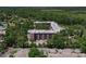 Beautiful condo complex from above surrounded by green trees and landscaping at 640 N Nova Rd # 117, Ormond Beach, FL 32174
