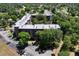 Beautiful aerial image highlighting the condo with parking and surrounding greenery at 640 N Nova Rd # 117, Ormond Beach, FL 32174