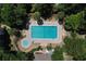 Aerial view of a sparkling pool and spa with manicured landscaping at 640 N Nova Rd # 117, Ormond Beach, FL 32174