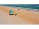 Serene beach scene with lounge chairs, umbrellas, and gentle waves, perfect for relaxing by the ocean at 640 N Nova Rd # 117, Ormond Beach, FL 32174
