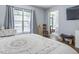 Bright bedroom with natural light, complemented by hardwood floors and neutral decor at 640 N Nova Rd # 117, Ormond Beach, FL 32174