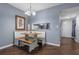 Charming breakfast nook featuring a built-in bench, wooden table, and decorative lighting fixture at 640 N Nova Rd # 117, Ormond Beach, FL 32174