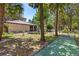 Exterior clubhouse with a patio for recreation, surrounded by landscaping and mature trees at 640 N Nova Rd # 117, Ormond Beach, FL 32174
