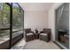 Screened in lanai featuring terrazzo floors and wicker furniture at 640 N Nova Rd # 117, Ormond Beach, FL 32174