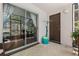 Screened in lanai featuring a sliding glass door and view of the outdoors at 640 N Nova Rd # 117, Ormond Beach, FL 32174