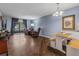 Living room features hard surface floors, neutral paint, recliners, and natural light at 640 N Nova Rd # 117, Ormond Beach, FL 32174