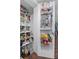 Organized pantry with shelving and door-mounted storage, maximizing space and convenience at 640 N Nova Rd # 117, Ormond Beach, FL 32174