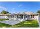 View of the backyard featuring a well-maintained lawn and a concrete patio at 807 Scrub Oak St, South Daytona, FL 32119