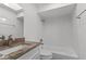 Bright bathroom featuring a vanity with stone countertops and a shower-tub combo with white tile at 807 Scrub Oak St, South Daytona, FL 32119
