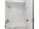 All-white bathroom features a shower and tub combination and white subway tile at 807 Scrub Oak St, South Daytona, FL 32119