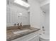 Bright bathroom featuring a vanity with stone countertops and a shower-tub combo with white tile at 807 Scrub Oak St, South Daytona, FL 32119
