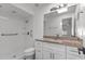Renovated bathroom with stone countertops, a glass-enclosed shower, and a modern vanity at 807 Scrub Oak St, South Daytona, FL 32119