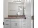 Bathroom features updated vanity with granite counters and decorative lighting at 807 Scrub Oak St, South Daytona, FL 32119