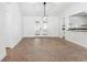 Spacious dining room featuring an open floor plan, tile flooring, and large windows overlooking a lush green backyard at 807 Scrub Oak St, South Daytona, FL 32119