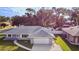 Charming single-story home with a gray roof, well-manicured lawn, and a two-car garage at 807 Scrub Oak St, South Daytona, FL 32119