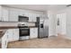 Modern kitchen equipped with stainless steel appliances and ample white cabinetry at 807 Scrub Oak St, South Daytona, FL 32119