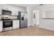 Clean and updated kitchen featuring stainless steel appliances and white cabinets at 807 Scrub Oak St, South Daytona, FL 32119